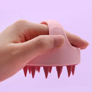 Pink silicone pet bath brush and massage tool for dogs and cats with ergonomic handle