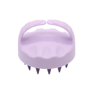 Purple silicone pet bath brush with massage bristles for gentle cleaning and grooming.