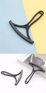 Detailed view of manual double-sided pet hair remover tool for carpets and sofas