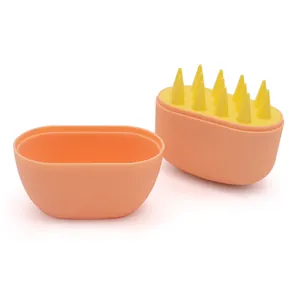 Two-piece orange and yellow silicone pet massage bath brush for dogs and cats, top view