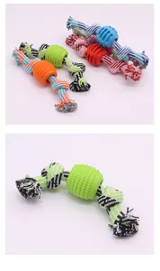 Close-up detail of durable knotted cotton rope dog toy with textured rubber ball