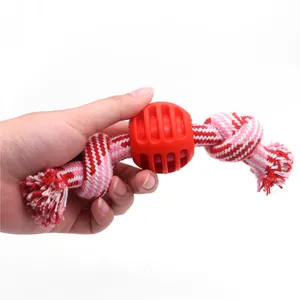 Durable cotton rope dog chew toy with central rubber ball for effective teeth cleaning