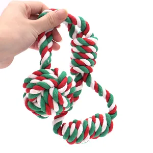 Christmas cotton rope dog chew toy in red, green, and white for interactive playing