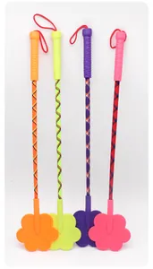 Detail of four colorful pet training slappers with paw-shaped paddles and textured handles