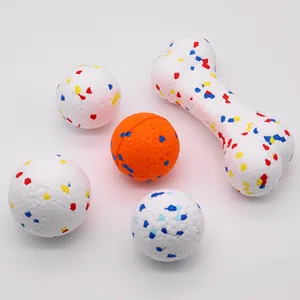 Durable ETPU elastic dog toy ball and bone set with colorful speckled pattern on white