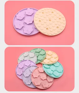 Detailed view of colorful rose-patterned silicone pet licking mats with suction cups