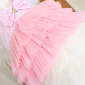Elegant pink dog princess dress with layered tutu skirt and pearl bow detail