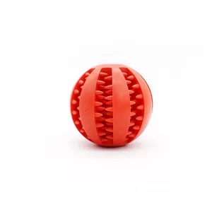 Red durable rubber spiked dog ball toy designed for treat dispensing and effective teeth cleaning.