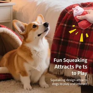 Jouet sonore Père Noël pour chien présenté avec un Corgi dans un intérieur douillet