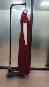 Detailed side view of a red retro high-neck maxi dress displayed on a mannequin.