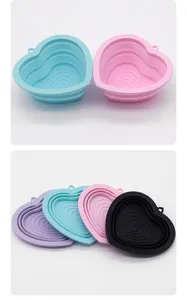 Heart-shaped collapsible silicone pet bowls shown in folded and unfolded states.