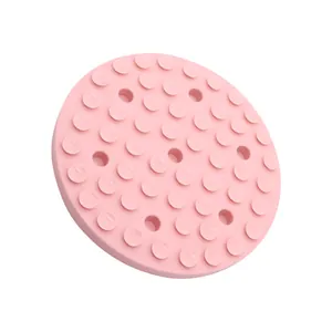 Round pink silicone dog licking mat with anti-slip suction cups for slow feeding