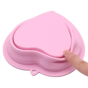 Pink heart-shaped silicone collapsible pet bowl for outdoor feeding and drinking