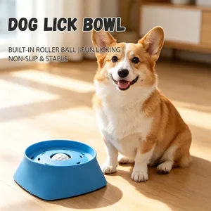 Blue silicone pet slow feeder bowl with a white roller ball, shown with a Corgi dog.