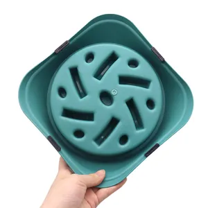 Bottom view of large teal slow feeder dog bowl with anti-slip feet.