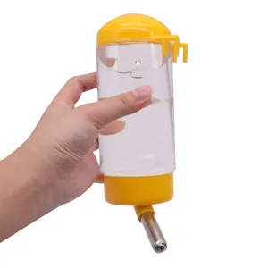 Bebedero de bola colgante amarillo para mascotas con botella transparente y boquilla