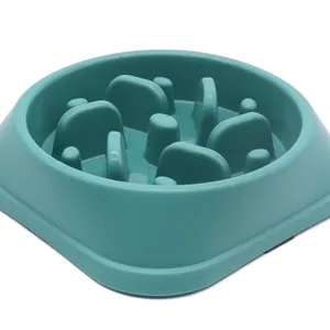 Durable teal blue pet slow feeder bowl with maze-like obstacles to prevent pet choking.