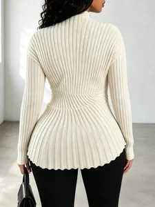Detailed rear view of a cream ribbed knit sweater featuring a flared hem design