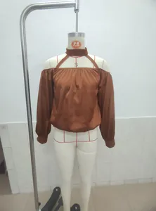 Elegant brown off-shoulder matte satin blouse with neck strap detail on mannequin