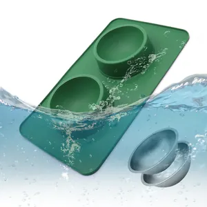 Dubbele hondenbakken van roestvrij staal met morsvrije groene siliconen antislip mat