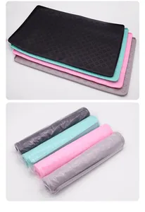 Detailed view of colorful silicone pet feeding mats in flat and rolled storage states.