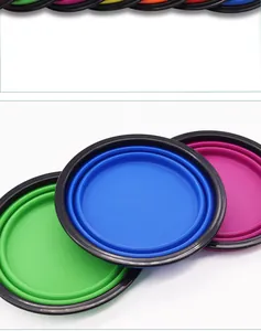 Detailed close-up of colorful collapsible silicone dog bowls in a flattened storage state.