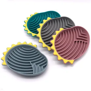 Four colorful silicone slow feeder lick mats for dogs with textured anti-choke maze design