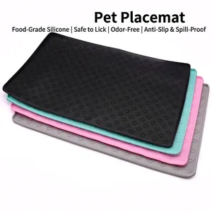 Non-slip food grade silicone pet feeding mat with raised edges and paw prints