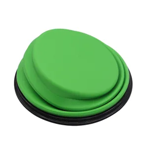 Portable collapsible green silicone pet bowl for dogs shown in its compact folded state.