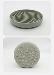 Detailed view of gray silicone slow feeder dog bowl showing interior ridges and suction cups