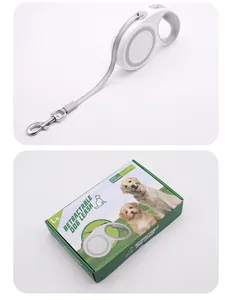White retractable dog leash with heavy-duty 5m nylon tape and green retail packaging box