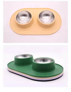 Detailed view of double pet bowls with stainless steel inserts and non-slip silicone base.
