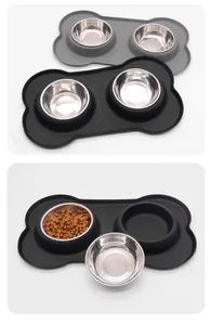 Double stainless steel pet bowls with non-slip bone-shaped silicone mat and kibble.