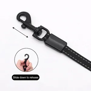 Retractable black pet leash with reflective stitching and slide-to-unlock clip