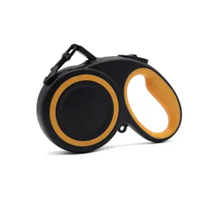 Retractable dog leash with ergonomic handle, black and yellow heavy-duty pet lead.