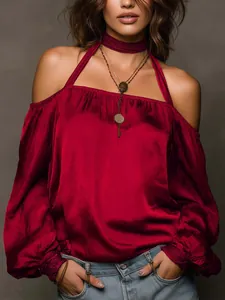 Detailed shot of elegant burgundy off-the-shoulder matte satin blouse with choker detail