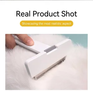 Detailed view of professional pet grooming comb removing loose fur from a white cat