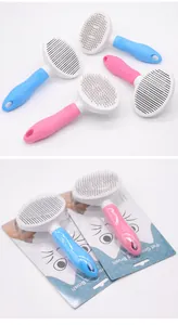 Detail view of blue and pink pet grooming brushes with stainless steel needles and packaging