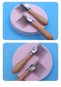 Close-up of pet dematting rakes with ergonomic wooden handles and steel teeth