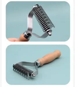 Close-up detail of a double-sided pet dematting rake with an ergonomic wooden handle