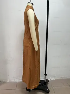 Side profile of a minimalist brown stand collar sleeveless maxi dress on a mannequin.