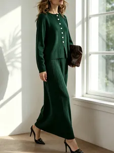 Elegant dark green knit cardigan and vertical stripe pleated maxi skirt two-piece set