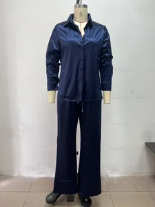 Elegant navy blue satin two-piece pajama set with long-sleeved shirt and trousers