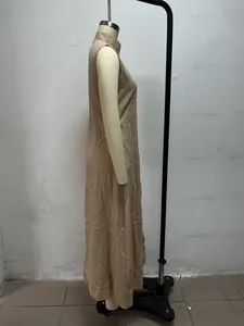 Detailed side view of minimalist khaki maxi dress with stand collar and no sleeves