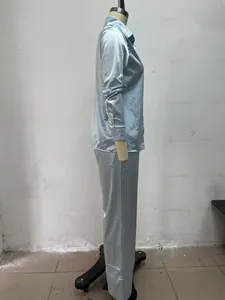 Detail view of light blue satin pajama set on a mannequin side profile