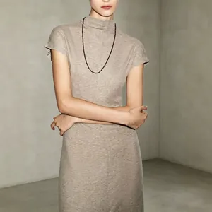 Elegant minimalist high-neck maxi dress with vintage aesthetic in oat heather knit