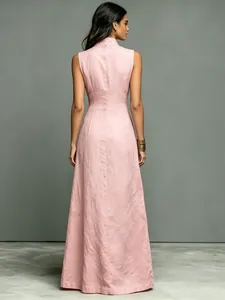 Back view of a minimalist light pink sleeveless maxi dress featuring a high stand collar