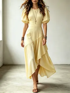 Detailansicht gelbes Kleid mit Laternenärmeln und gestuftem asymmetrischem Rüschensaum