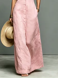 Minimalist pink linen blend sleeveless maxi dress featuring a single-breasted button-front design