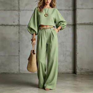 Chic sage green puff sleeve crop top and matching wide leg trousers two-piece set